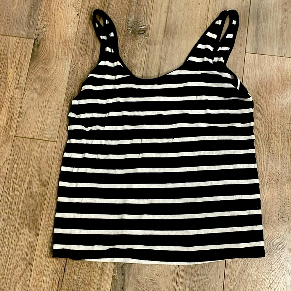 Cute black and white tank. Higher top lower back.